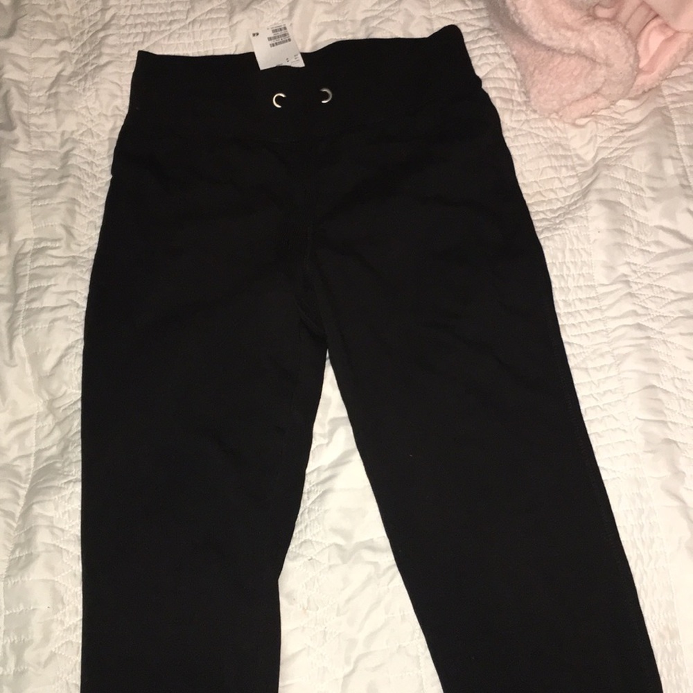 Black drawstring joggers.